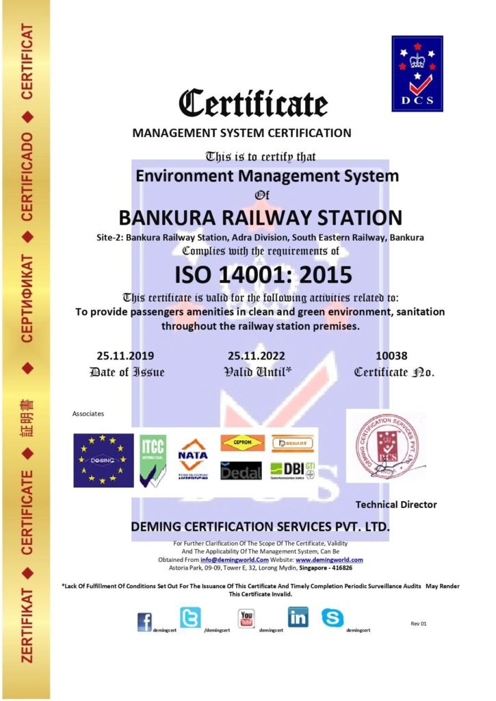Management System Certificate issued by Deming Certification Services Pvt. Ltd. certifying Bankura Railway Station (Adra Division, South Eastern Railway, Bankura) for ISO 14001:2015 Environment Management System compliance, featuring a vertical gold margin on the left and international accreditation logos along the bottom.