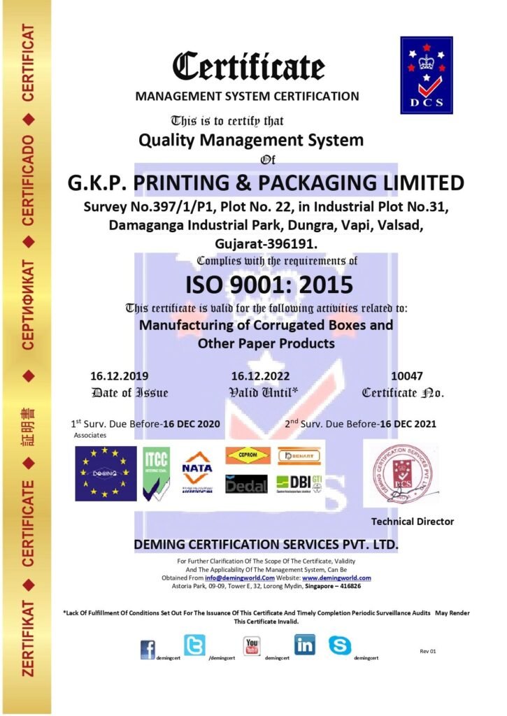 Management System Certificate issued by Deming Certification Services Pvt. Ltd. certifying G.K.P. Printing & Packaging Limited in Vapi, Valsad, Gujarat for Quality Management System compliance under ISO 9001:2015, featuring a vertical gold margin on the left and international accreditation badges along the bottom.